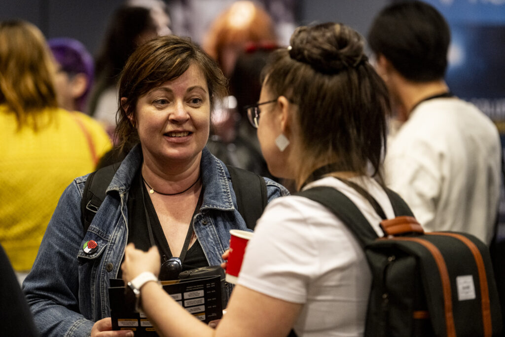 Two delegates in conversation during a BFI FAN Con networking event