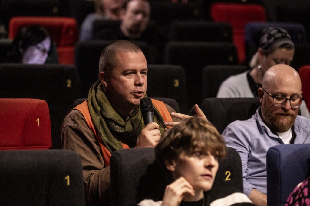 A man asks a question during a BFI FAN Con talk