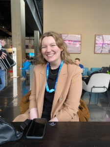 Image of a smiling woman sitting in the BFI Foyer.